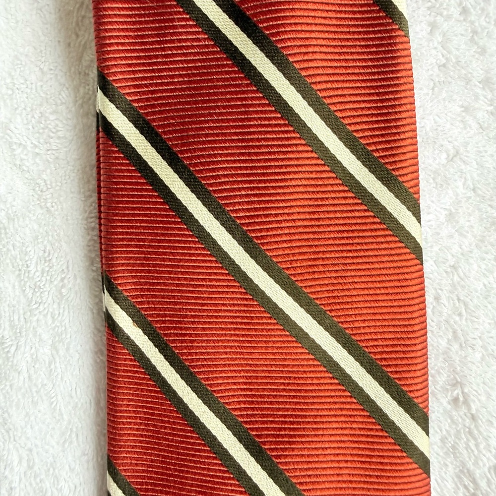 Brooks Brothers silk tie.    Orange with black / white  stripes.